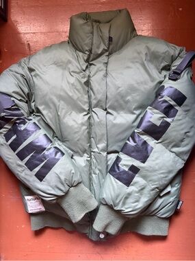 nununu Olive Green Puffer Jacket with Black Sleeve Graphics